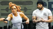 Josh-Gallegos-Training-Becky-Lynch-On-Bike.webp