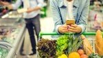 Girl shopping for groceries while on her phone