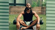 Hip hop performer Olu from the group Earthgang meditating