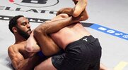 MMA fighter AJ McKee trapping his opponent in a submission