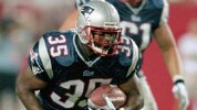 Patrick Pass #35 of the New England Patriots carries the ball against the Washington Redskins during an NFL football game circa 2000 at RFK Stadium in Washington. Focus on Sport/Getty Images