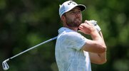 PGA golfer and Elite golfer Sam Burns using his iron to hit the golf ball from the fairway