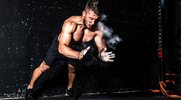 Fit athletic man using the rapid drop catch method to his pushup exercise and workout