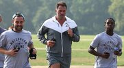 Boxing promoter Eddie Hearn running with his team