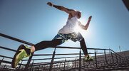 Fit muscular man improving his cardio with a 15 minute outdoor stair workout