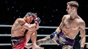 Muay Thai World title holder Nico Carrillo throwing a kick to his opponent