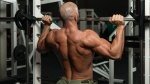 Man performing smith machine exercises for his back muscles