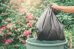 man-throwing-out-trash-bag-1024x682.webp