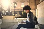 woman-at-laptop-outside-1024x679.webp