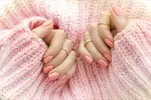 Hands-with-pink-manicure.webp