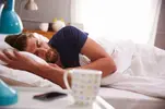 coffee-nap-man-in-bed-1024x682.webp