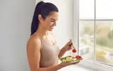 fit-female-eating-breakfast.webp