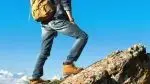 Man-In-Work-Boots-And-Jeans-Hiking.webp