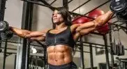 a-Winner-Andrea-Shaw-performing-a-dumbbell-workout.webp