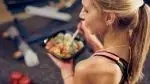 Fitness-Girl-Eating-Salad.webp