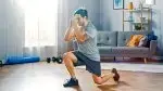 ale-Performing-Split-Squat-In-Living-Room-Home-Gym.webp