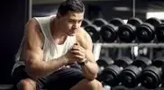 builder-In-Front-of-Dumbbell-Rack-Thinking-Pensive.webp