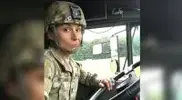 making-a-funny-face-while-driving-a-military-truck.webp