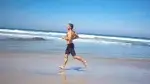 Ask-andy-mcdermott-running-on-the-beach.webp