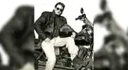 Photographer-Bill-Dobbins-riding-a-motorcycle.webp