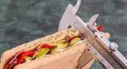 Measuring-a-sandwich-with-a-caliper.webp