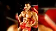 lder-Samir-Bannout-wearing-red-shorts-and-smirking.webp