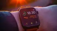 Apple-WatchOS-9-against-a-sunset.webp