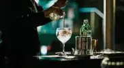 Bartender-and-mixologist-making-a-gin-coctail.webp