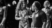 Tony-Roberts-at-a-women-bodybuilding-competition.webp