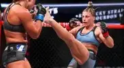 ayla-Harrison-throwing-a-high-kick-to-her-opponent.webp