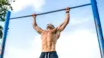 Man-Pullup-Park-Blue-Skies.webp