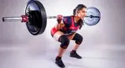 enjeet-Kaur-Bains-performing-a-back-squat-exercise.webp