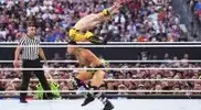 -jumping-over-a-WWE-wrestler-in-the-squared-circle.webp