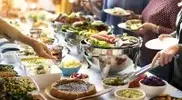 Many-People-On-Buffet-Line-Serving-Food.webp