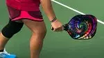 playing-pickleball-and-holding-a-pickleball-paddle.webp