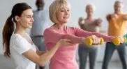 female-working-out-with-dumbbells-during-menopause.webp