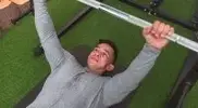 Muscular man making inverted row mistakes- wrong hand position