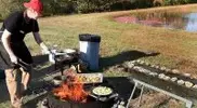 Stephen Coe grilling outdoors