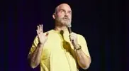 Tom Segura transformation on stage performing standup