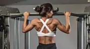 Coach Naomi Doran performing a back exercise