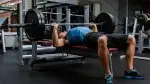 Man performing isometric exercises and training with a isometric bench press