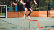 Athlete performing hurdle hops for his plyometric workout