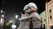 Colin O’Brady and Lucas Clarke embrassing each other in celebration after finishing the Race Across America