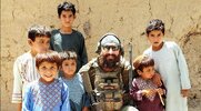 US Army Sergeant Major Greg Keller with native kids