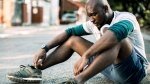 Man-Tired-Sitting-On-Streets