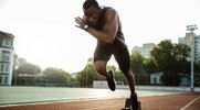 Sprinter taking off on the sprinting track after performing warm ups for sprinting